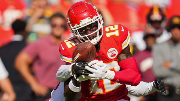 Chiefs wide receiver Josh Gordon (12) catches a pass against Washington Commanders cornerback Corn Elder during a preseason game.